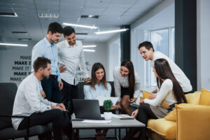 Into success. Group of young freelancers in the office have conversation and smiling